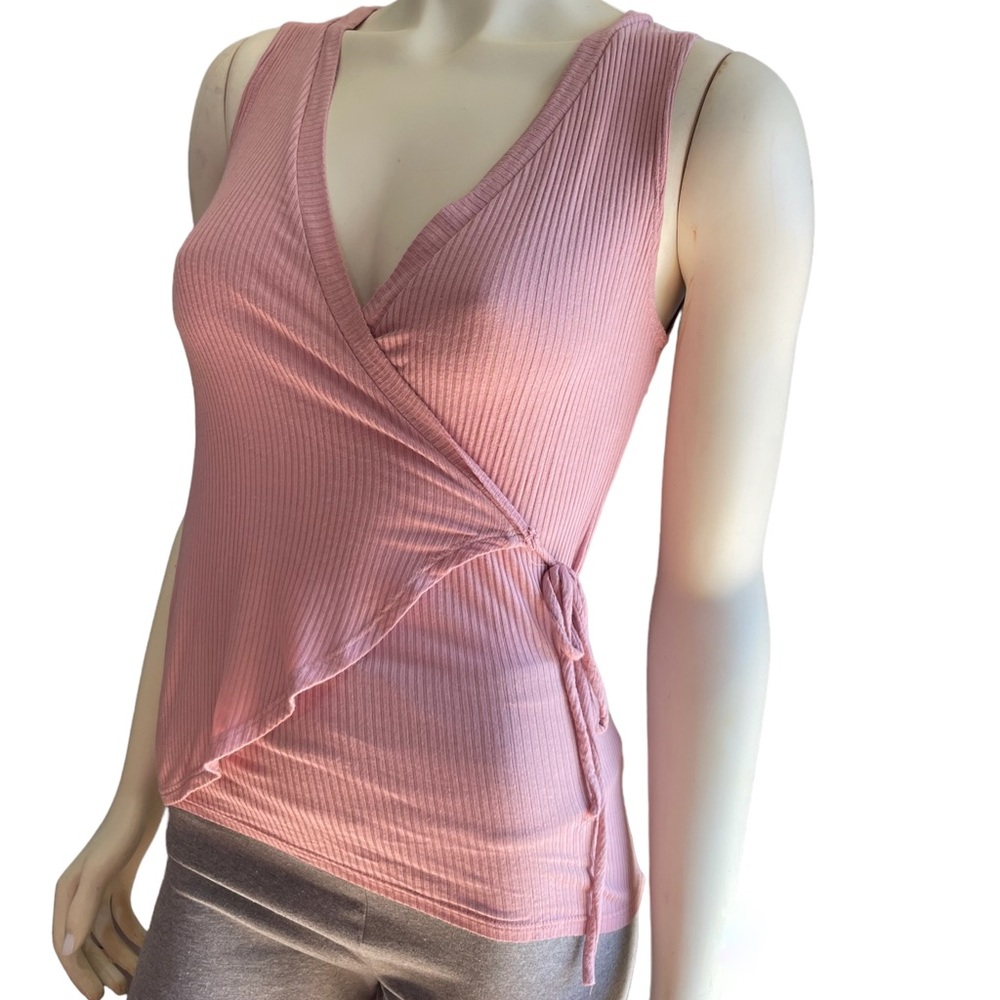 Wrap sleeveless blouse in blush pink color and size small